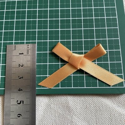 画像1: １０個！可愛いリボンモチーフ　上品なオレンジ　ハンドメイドに　たて約3.7cm×横約7cm